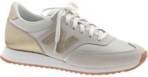 new balance gold sneakers